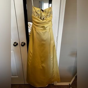 Yellow floor length prom dress.